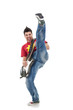 Photo: guitarist kicking while performing guitarist kicking while performing