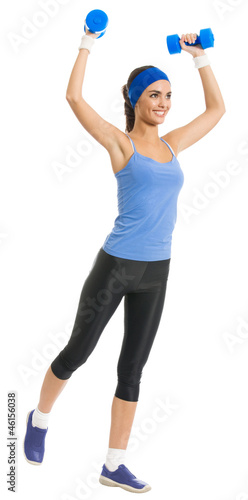Photo: Cheerful woman exercising with dumbbells, over white Cheerful woman exercising with dumbbells, over white
