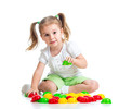 Cute child playing with  mosaic toy