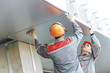 facade workers installing metal boarding
