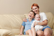 Foto: Happy mother with two children. Happy mother with two children.