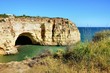 Algarve cliffs forming a bay and caves