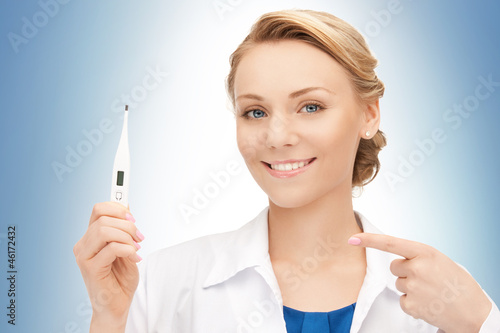 Photo: attractive female doctor with thermometer attractive female doctor with thermometer