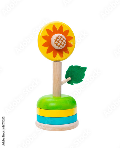 Photo: Colorful wooden sunflower toy isolates Colorful wooden sunflower toy isolates