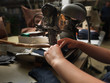Photo: adult man working in a shoe factory adult man working in a shoe factory