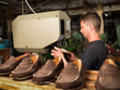 adult man working in a shoe factory