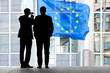 Two employees of the European Communities.