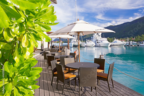 Photo: Cozy restaurant on decking by the beautiful marina Cozy restaurant on decking by the beautiful marina
