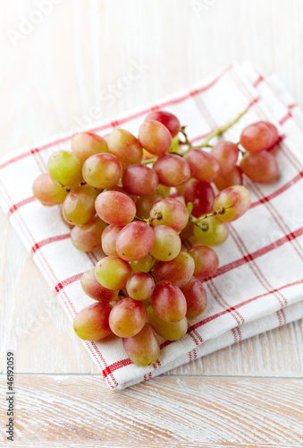 Photo: Bunch of grapes on kitchen towel Bunch of grapes on kitchen towel