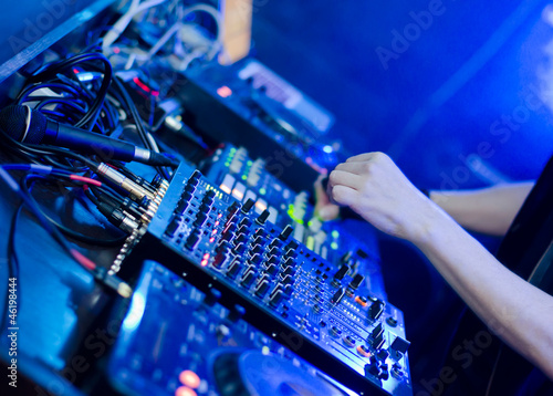 Photo: DJ set: DJ hands and DJ desk DJ set: DJ hands and DJ desk