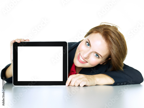 Photo: Business woman presenting her tablet pc with copyspace Business woman presenting her tablet pc with copyspace
