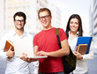 group of young students against a university