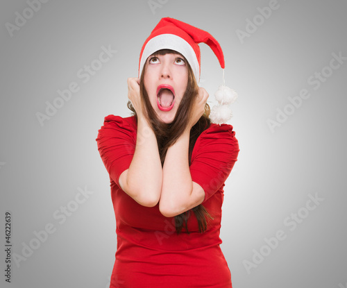 Photo: stressed woman wearing a christmas hat stressed woman wearing a christmas hat