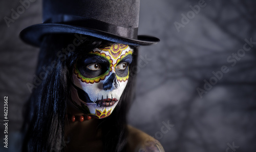Photo: Sugar skull girl in tophat in the forest Sugar skull girl in tophat in the forest