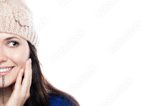 Photo: Young woman with hat is looking to the right Young woman with hat is looking to the right