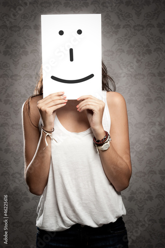 Photo: woman holding smile symbol woman holding smile symbol