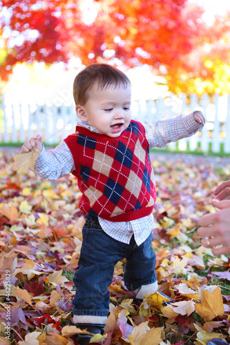 Photo: Cute Boy Playing in Leaves Cute Boy Playing in Leaves