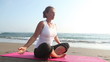 Spirituality woman sitting in pose lotus at coastline