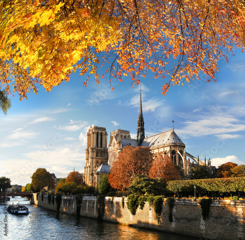 Photo: Notre Dame with boat on Seine in Paris, France Notre Dame with boat on Seine in Paris, France