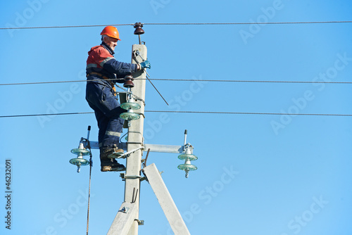 Photo: power electrician lineman at work on pole power electrician lineman at work on pole