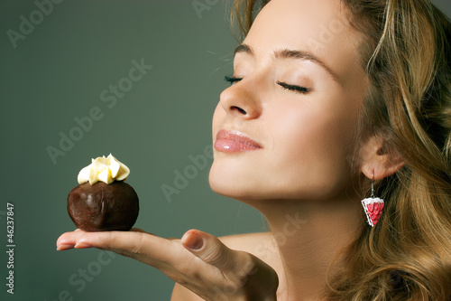 Photo: Young Blonde Woman Eating the Cake Young Blonde Woman Eating the Cake