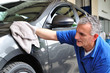 Man cleaning a car.