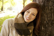 Beautiful young woman in autumn clothes