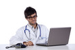 frendly young doctor working with his laptop