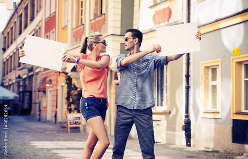 Photo: Cute couple with advertise Cute couple with advertise