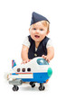 baby girl dressed as  stewardess with airplane toy