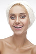 Beautiful young woman posing in white towel.