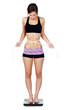 Very thin woman on scale