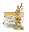 statue of justice, money and books on a white background