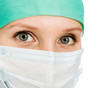 Photo: Surgeon woman in protective mask Surgeon woman in protective mask