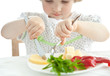 Little girl eating her dinner
