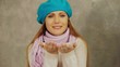 Video: Pretty woman in scarf blowing snow Pretty woman in scarf blowing snow