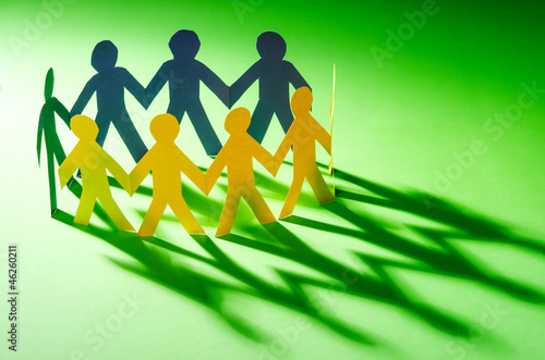 Photo: Paper people in teamworking concept Paper people in teamworking concept
