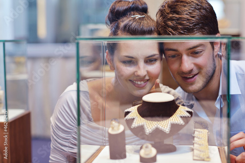 Photo: happy young couple in jewelry store happy young couple in jewelry store
