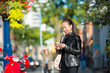 young woman walking and talking on the smartphone