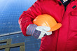 Worker holding hardhat