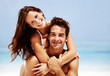 Romantic young couple enjoying their beach vacation