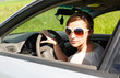 girl with glasses while driving