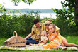 Happy family picnicking outdoors