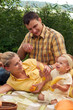 Happy family picnicking outdoors