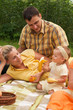 Happy family picnicking outdoors