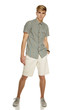 Photo: Young handsome male in shorts posing in full length Young handsome male in shorts posing in full length