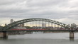 Trains go on the railway bridge in Cologne, Germany
