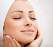 Photo: Sweet young woman with hands on her neck Sweet young woman with hands on her neck