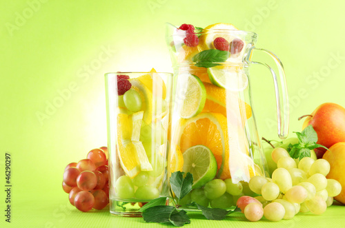 Photo: jar and glass with citrus fruits and raspberries, jar and glass with citrus fruits and raspberries,