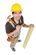 Carpenter with wood and a hammer